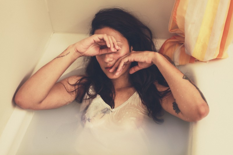 Image of woman in bathtub full of water